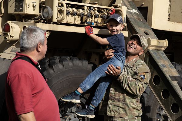 U.S. Army Sgt. Francisco Quinones with Golf “Gambler” Company, 2nd Battalion, 69th Armored Regiment “Panther Battalion,” 2nd Armored Brigade Combat Team, 3rd Infantry Division, shows a child how to move and operate a hitch on the back of a HEMTT M984A4 recovery vehicle during the Polish Army’s “11th Cavalry competition for the mayor of Ostroeɫęka cup” in Ostroeɫęka, Poland, Sept. 24. The event is held every year in honor of the Polish regiment that defended the city in the 1920s. The 3rd Infantry Division’s mission in Europe is to engage in multinational training and exercises across the continent, working alongside NATO allies and regional security partners to provide combat-credible forces to V Corps, America’s forward deployed corps in Europe. (U.S. Army photo by Alex Soliday)