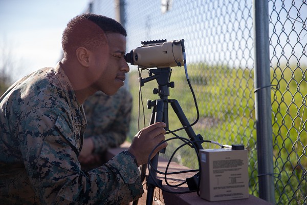U.S. Marine Corps Cpl. Trent Holton, a transmissions system operator with 9th Communication Battalion, I Marine Expeditionary Force Information Group, sights into the common laser range finder-integrated capability system as part of a call-for-fire practical application class during the ANGLICO Basic Course at Marine Corps Base Camp Pendleton, California, March 8, 2023. ABC graduates will depart as technically and tactically proficient Marines capable of making sound decisions in complex operational situations and with a baseline understanding of ANGLICO mission-specific skill sets, regardless of military occupational specialty. (U.S. Marine Corps photo by Lance Cpl. Trent A. Henry)