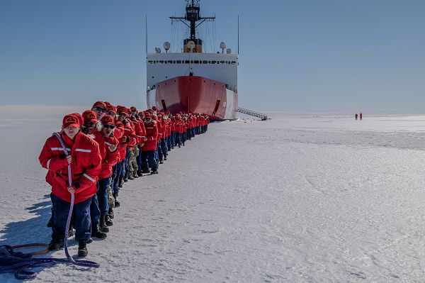 The crew of the U.S. Coast Guard Cutter Polar Star (WAGB 10) “tows” the cutter while on the fast ice in McMurdo Sound, Antarctica, Dec. 29, 2023. The U.S. military's support of U.S. Antarctic research began in 1955. U.S. Indo-Pacific Command continues to lead the Joint Task Force-Support Forces Antarctica team in providing logistic support for the United States Antarctic Program. (U.S. Coast Guard photo by Petty Officer 3rd Class Ryan Graves)