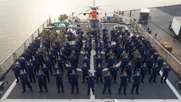 Crew members of the U.S. Coast Guard Cutter Waesche (WMSL 751) stand at attention on the flight deck of the cutter in San Diego, December 6, 2023. The Waesche's crew will prepare to offload drugs interdicted in the Eastern Pacific during counter-narcotic patrols by Coast Guard cutters Active and Waesche, eliminating 8,264 Kilograms of cocaine worth an estimated $239.7 million in value. (U.S. Coast Guard photo by Petty Officer 3rd Class Richard Uranga)