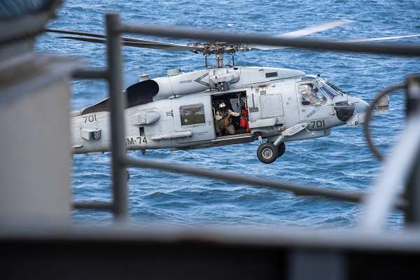 An MH-60R Sea Hawk helicopter, attached to the &quot;Swamp Foxes&quot; of Helicopter Maritime Strike Squadron (HSM) 74, lands on the flight deck onboard the aircraft carrier USS Dwight D. Eisenhower (CVN 69), Dec. 17, 2023. The Dwight D. Eisenhower Carrier Strike Group is deployed to the U.S. 5th Fleet area of operations to support maritime security and stability in the Middle East region. (U.S. Navy photo by Mass Communication Specialist 3rd Class Nicholas Rodriguez)