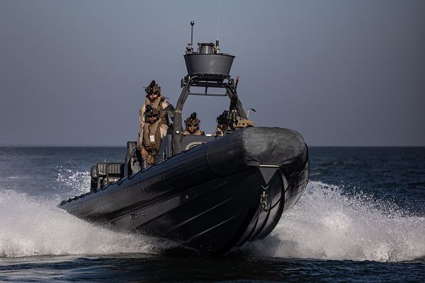 U.S. Marines with Battalion Landing Team (BLT) 1/8, 24th Marine Expeditionary Unit (MEU) operate a rigid-hull inflatable boat during visit, board, search and seizure (VBSS) training in the Chesapeake Bay, off the coast of Virginia, Oct. 30, 2023. The VBSS course teaches Marines with MSPF and Battalion Landing Team 1/8 how to properly conduct vessel boarding procedures and maritime interdiction operations while underway with the 24th MEU. (U.S. Marine Corps photo by Lance Cpl. Ryan Ramsammy)