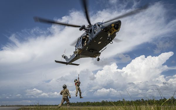 An MH-139A Grey Wolf lifts an Air Force Global Strike Command Detachment 7 special mission aviator into the air as part of live hoist testing April 26, 2023, at Eglin Air Force Base, Fla. The 413th Flight Test Squadron and Det. 7 worked together to successfully complete the test for the Air Force’s newest helicopter. (U.S. Air Force photo by Samuel King Jr.) 