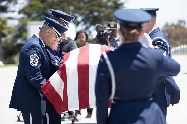 Airmen from the 60th Air Mobility Wing Honor Guard conduct a funeral for Col. Ernest L. De Soto at Golden Gate National Cemetery in San Bruno, Calif., June 30, 2023. De Soto was accounted for by the Defense POW/MIA Accounting Agency on March 23, 2023, and returned to his family for burial with full military honors. (U.S. Air Force photo by Senior Airman Alexander Merchak) 