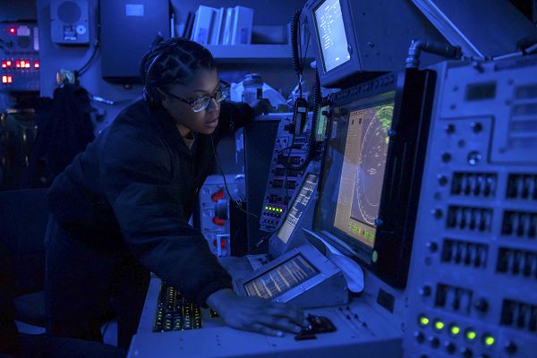 PACIFIC OCEAN (Aug. 30, 2023) Operations Specialist 2nd Class Tenisha Clayton, from Roxboro, N.C., stands watch in the combat information center aboard the aircraft carrier USS Nimitz (CVN 68). Nimitz is underway conducting routine operations. (U.S. Navy photo by Mass Communication Specialist 3rd Class Brittney Camacho-Pietri)                    