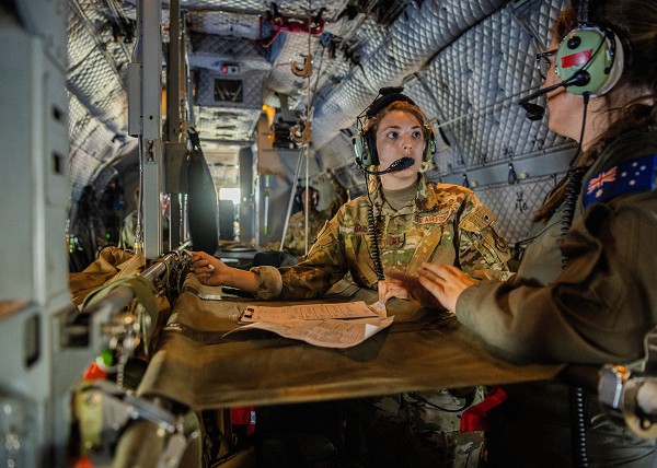 U.S. Air Force Capt. Shailey Dao, flight nurse, receives in-flight contingency response training from a Royal Australian Air Force service member while aboard a C-27J Spartan during exercise Cope North 2023 near Andersen Air Force Base, Guam, Feb. 14, 2023. The U.S., Australia and Japan displayed the coalition’s interoperability and airpower resilience and survivability across the Indo-Pacific. (U.S. Air Force photo by Tech. Sgt. Jao’Torey Johnson) 