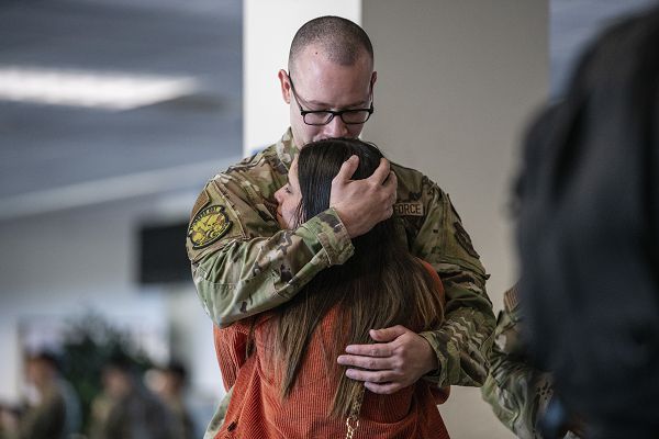 Senior Airman Osvaldo Rodriguez Matias, 860th Aircraft Maintenance Squadron C-17 Globemaster III crew chief, spends time with a loved one before he deploys from Travis Air Force Base, Calif., Sept. 27, 2023. More than 400 Airmen were the first on Travis AFB to experience Air Force Force Generation — the Air Force’s new deployment model. (U.S. Air Force photo by Nicholas Pilch) 