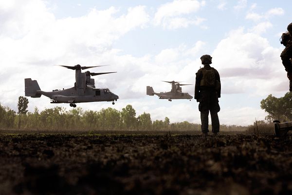 U.S. Marine Corps 1st Lt. Joshua Watson, the executive officer of Lima Co., 3rd Battalion, 1st Marine Regiment (Reinforced), Marine Rotational Force – Darwin 23, watches MV-22B Osprey tiltrotor aircraft land during Exercise Southern Jackaroo 23 in Townsville Field Training Area, Queensland, Australia, July 6, 2023. Southern Jackaroo is a trilateral exercise with MRF-D, Japanese Ground Self-Defense Force, and Australian Defence Force, with Republic of Korea observers, working together to achieve fire, maneuver, and communications interoperability objectives. Watson is a native of Woodbridge, Virginia. (U.S. Marine Corps photo by Cpl. Brayden Daniel)  