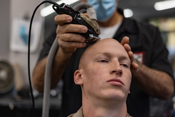 U.S. Marine Corps Recruit Levi Castleman a recruit with Golf Company, 2nd Recruit Training Battalion, receives his weekly haircut at Marine Corps Recruit Depot (MCRD) San Diego, March 1, 2023. Recruits receive haircuts weekly during their time at MCRD San Diego in order to maintain a uniform appearance and promote good hygiene throughout recruit training. Castleman was recruited out of Amarillo, TX, with Recruiting Station Albuquerque, NM. (U.S. Marine Corps photo by Lance Cpl. Jacob B. Hutchinson)
