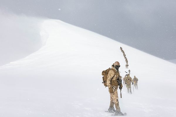 U.S. Marines with 1st Battalion, 4th Marine Regiment, 1st Marine Division, and members of the Chilean naval infantry climb Mount Tarn for the culminating event of a bilateral cold weather training exercise near Punta Arenas, Chile, Aug. 23, 2023. Throughout the exercise, Marines learned proper techniques for obtaining food and water, employed different weapons and gear, built shelters, practiced foot movements over snow, and conducted cold weather personnel rescue. Training exchanges in South America provide U.S. forces opportunities to train in exotic environments such as humid jungles, frigid mountains, and complex waterways while strengthening partnership and enhancing overall interoperability with regional partners. (U.S. Marine Corps photo by Sgt. Cameron Hermanet)