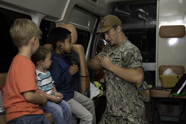 YOKOSUKA, Japan (Oct. 24, 2023) Naval Hospital Yokosuka provide an ambulance and other medical equipment to showcase lifesaving and triage procedures during the First Responders Tuesday Night Lights event , Oct. 24, 2023, in the commissary parking lot at Commander, Fleet Activities Yokosuka (CFAY). First Responders Night is an event that unites our community and serves as a catalyst for building trust and strong relationship between our dedicated first responders (on and off base), including firefighters, police officers, paramedics, emergency medical technicians and the people they serve. For more than 75 years, CFAY has provided, maintained, and operated base facilities and services in support of the U.S. 7th Fleet's forward-deployed naval forces, tenant commands, and thousands of military and civilian personnel and their families. (U.S. Navy photo by Tetsuya Morita)                  