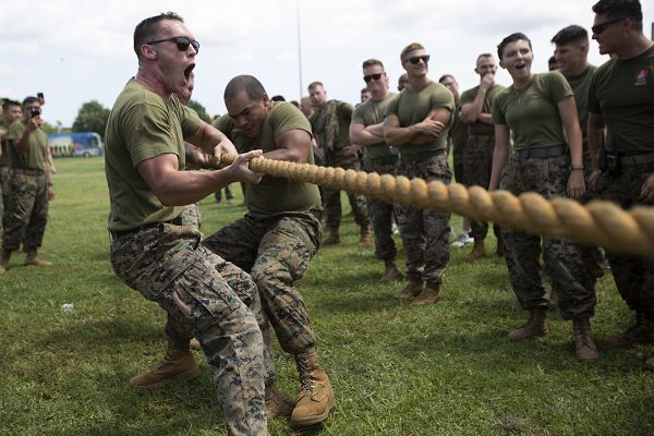 U.S. Marines with Fleet Marine Force, Atlantic (FMFLANT), Marine Forces Command (MARFORCOM), Marine Forces Northern Command (MARFOR NORTHCOM), and their respective Headquarters and Service Battalion (HQSVCBN), compete in a tug-o-war competition during a regional field meet at Captain Slade Cutter Park, Virginia, August 5, 2022. Marines, across various units competed head-to-head in pugil sticks, ground fighting, PVC pipe construction, flag football, resupply runs, rowing, kickball, and tug-o-war in order to win the command trophy. FMFLANT, MARFORCOM, MARFOR NORTHCOM holds field meets regularly to sustain camaraderie and healthy work relations. (U.S. Marine Corps photo by Lance Cpl. Jack Chen)