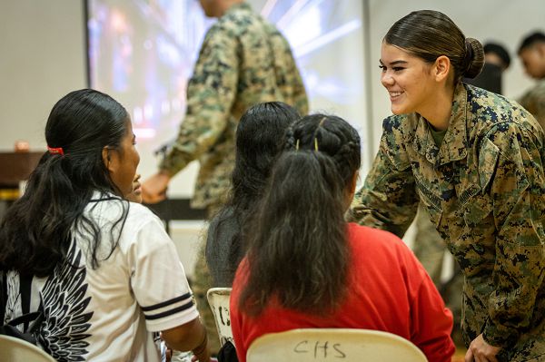 U.S. Marine Corps Lance Cpl. Megan Roundpoint, a native of Akwesasne, New York and a motor transport operator with Task Force Koa Moana 23, speaks to Chuuk High School students during a recruiting event at Chuuk High School on Weno, Chuuk, Federated States of Micronesia, Sept. 14, 2023. The state of Chuuk is a part of Task Force Koa Moana’s deployment throughout the Indo-Pacific region, where Marines and Sailors from I Marine Expeditionary Force work to strengthen alliances and partnerships with development of interoperable capabilities, combined operations, theater security cooperation, and capacity-building efforts. (U.S. Marine Corps photo by Cpl. Trent A. Henry)