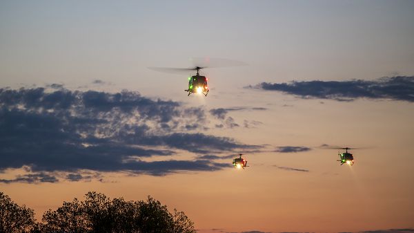 Three U.S. Air Force UH-1N Huey helicopters from the 1st Helicopter Squadron, Joint Base Andrews, Md., prepare to land on the National Mall, Washington, D.C., during a routine training flight, April 6, 2023. First HS's mission is to provide priority airlift for national-level civil and military senior leadership in the National Capital Region. (U.S. Air Force photo by Master Sgt. Nicholas Priest)