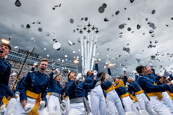 The U.S. Air Force Academy Class of 2023 graduates toss their hats into the sky as the U.S. Air Force Air Demonstration Squadron &quot;the Thunderbirds&quot; roar overhead at the Academy's Falcon Stadium in Colorado Springs, Colo., June 1, 2023. Nine-hundred twenty-one cadets crossed the stage to become the Air Force and Space Force’s newest second lieutenants. (U.S. Air Force photo by Trevor Cokley)