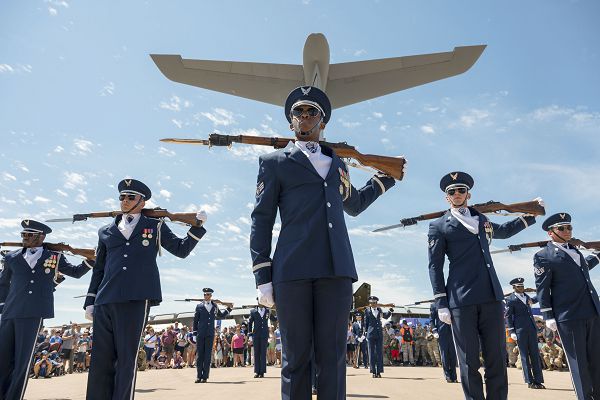 The U.S. Air Force Honor Guard Drill Team performs for a crowd at EAA AirVenture Oshkosh in Oshkosh, Wis., July 29, 2023. The Honor Guard's primary mission is to deliver premier ceremonial honors and represent Airmen to the American public and the world. (U.S. Air Force photo by Kristen Wong) 