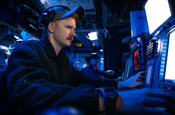 ARABIAN GULF (June 25, 2023) Lt. Samuel Gilbert stands watch aboard the guided missile destroyer USS McFaul (DDG 74) during an inbound sea and anchor evolution in the Arabian Gulf, June 25, 2023. McFaul is deployed to the U.S. 5th Fleet area of operations to help ensure maritime security and stability in the Middle East region. (U.S. Photo by Mass Communication Specialist 2nd Class Juel Foster)       