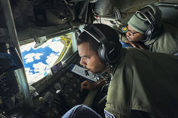 U.S. Air Force Airman 1st Class Anthony Toliver, 351st Air Refueling Squadron KC-135 Stratotanker aircraft boom operator, and Tech. Sgt. Fernando Brome, 351st Air Refueling Squadron KC-135 Stratotanker boom operator, prepare a KC-135 flying boom for aerial refueling operations over the European area of responsibility, Nov. 8, 2023. Brome was evaluating Toliver to ensure that he was able to perform in-flight refueling procedures correctly and safely. (U.S. Air Force photo by Airman 1st Class Christopher Campbell) 