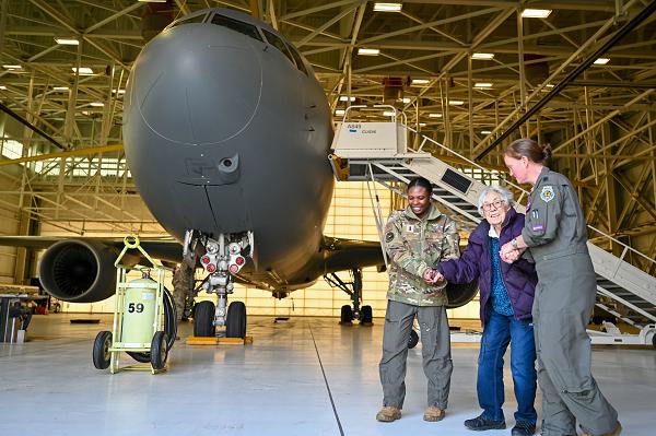 First Lt. Micala Bruce, 349th Air Refueling Squadron pilot, and Lt Col. Kristen Smith, 349th ARS director of operations, walk with WWII veteran Katie Conkling at McConnell Air Force Base, Kan., Jan. 18, 2024. Conkling celebrated her 103rd birthday with a tour of the base and the inside of KC-46A Pegasus. (U.S. Air Force Photo by Airman 1st Class Gavin Hameed) 