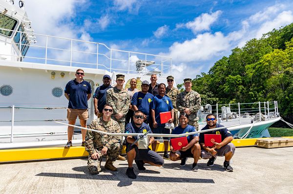 U.S. Marines with Task Force Koa Moana 23 and Palauan Maritime Law Enforcement Officers pose for a photograph at the conclusion of the Task Force Koa Moana RQ-20B Puma Training Course graduation at the Palau Joint Operations Center, Bureau of Maritime Security and Fish &amp; Wildlife Protection, Koror, Palau, Sept. 14, 2023. Task Force Koa Moana 23, composed of U.S. Marines and Sailors from I Marine Expeditionary Force, deployed to the Indo-Pacific to strengthen relationships with Pacific Island partners through bilateral and multilateral security cooperation and community engagements. (U.S. Marine Corps photo by Staff Sgt. Courtney G. White)