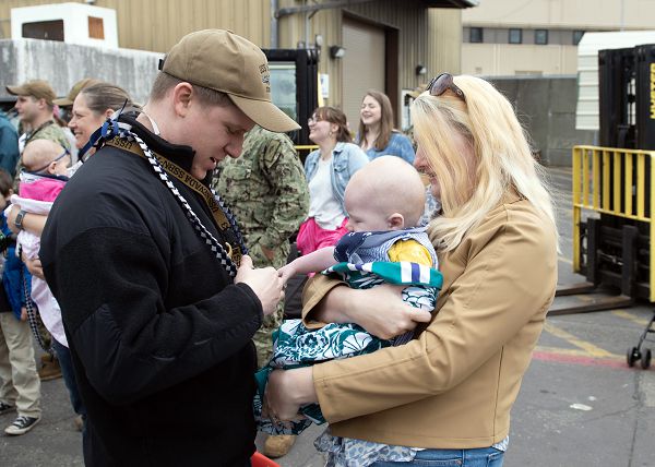 NAVAL BASE KITSAP Ð BANGOR, Wash. (May 22, 2023) MachinistÕs Mate (Nuclear) 1st Class John Brillhart, assigned to the Ohio-Class ballistic missile submarine USS Nevada (SSBN 733), meets his son or the for the first time during the boatÕs return to homeport at Naval Base Kitsap Ð Bangor, Wash., May 22, 2023. Nevada is one of eight ballistic-missile submarines stationed at Naval Base Kitsap-Bangor, providing the most survivable leg of the strategic deterrence triad for the United States. (U.S. Navy photo by Mass Communication Specialist 1st Class Brian G. Reynolds)