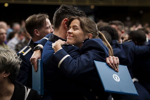 Newly commissioned 2nd Lt. Lexi De Villiers, right, embraces a fellow graduate following the U.S. Air Force Academy’s 2023 Winter Graduation ceremony, Dec. 15, 2023, in Colorado Springs, Colo. In total, USAFA commissioned 32 seniors into the U.S. Air Force and U.S. Space Force. (U.S. Air Force photo by Justin R. Pacheco) 