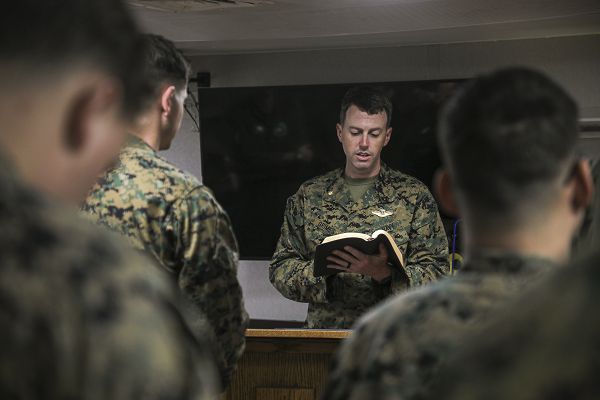 SOUTH CHINA SEA (Jan. 22, 2023) - U.S. Navy Lt. Cmdr. Austin Grimes, a chaplain with 13th Marine Expeditionary Unit, leads a chapel service aboard the amphibious assault ship USS Makin Island (LHD 8), Jan. 22. The 13th MEU is embarked on the Makin Island Amphibious Ready Group, comprised of the Makin Island and amphibious transport dock ships USS John P. Murtha (LPD 26) and USS Anchorage (LPD 23), and operating in the U.S. 7th Fleet area of operations. 7th Fleet is the U.S. Navy's largest forward-deployed numbered fleet, and routinely interacts and operates with Allies and partners in preserving a free and open Indo-Pacific region. (U.S. Marine Corps photo by Cpl. Carl Matthew Ruppert)