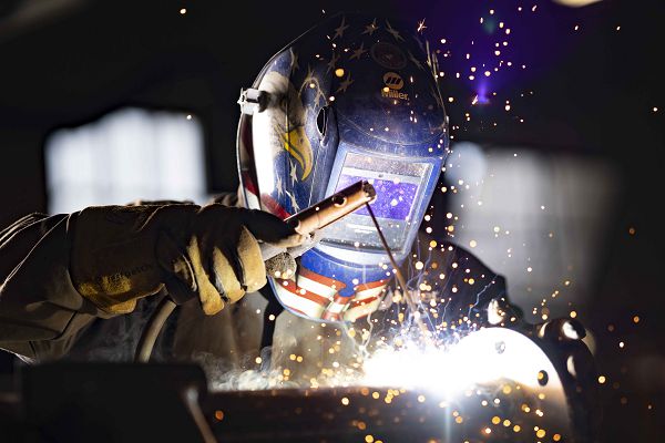 Carlos Ramirez, 502nd Civil Engineer Squadron structures shop welder, welds a boiler pipe flange at Joint Base San Antonio-Fort Sam Houston, Texas, June 8, 2023. The welding shop at 502nd CES has completed more than 1,000 welding jobs so far this year, allowing the training mission at JB San Antonio-Fort Sam Houston to continue unabated. (photo by Jonathan Mallard) 