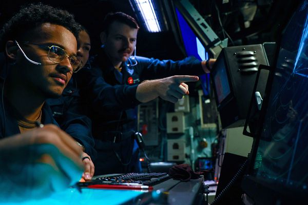 MEDITERRANEAN SEA (Aug. 5, 2023) Sailors assigned to Tactical Air Control Squadron 21 track the movement of aircraft within the vicinity of the Wasp-class amphibious assault ship USS Bataan (LHD 5). Bataan, along with the Harpers Ferry-class dock landing ship USS Carter Hall (LSD 50) are currently on a scheduled deployment to the U.S. 5th and U.S. 6th Fleet areas of responsibility. The U.S. Navy and U.S. Marine Corps routinely participate in scheduled deployments to improve combined combat readiness, increase operational capacity, and strengthen relationships among allies and partners throughout the region. (U.S. Navy photo by Mass Communication Specialist 3rd Class Riley Gasdia)