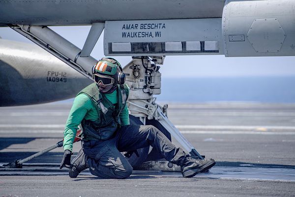 PHILIPPINE SEA (May 16, 2023) A U.S. Navy Sailor prepares an F/A-18E Super Hornet from the “Kestrels” of Strike Fighter Squadron (VFA) 137 to launch from the flight deck of the aircraft carrier USS Nimitz (CVN 68). Nimitz is in U.S. 7th Fleet conducting routine operations. 7th Fleet is the U.S. Navy's largest forward-deployed numbered fleet, and routinely interacts and operates with allies and partners in preserving a free and open Indo-Pacific region. (U.S. Navy photo by Mass Communication Specialist 2nd Class Justin McTaggart)