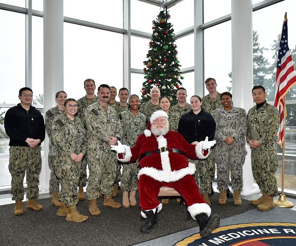 Seasonal Santa festivities at Naval Hospital Bremerton….NHB’s annual tree lighting ceremony to commemorate the trilogy of light, faith and hope that embodies the observance was enhanced by a special visit from Father Christmas who took the time to share well wishes and warm greetings with staff, patient and visitor alike…(Official Navy photo by Douglas H Stutz, NHB/NMRTC Bremerton public affairs officer).