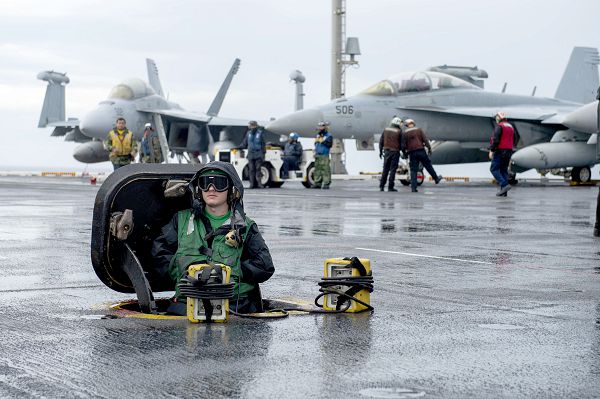 PACIFIC OCEAN (Nov. 15, 2023) Aviation Boatswain’s Mate (Equipment) 3rd Class Robert Hill, from Kansas City, Kan., operates the jet blast deflector on the flight deck of the Nimitz-class aircraft carrier USS Theodore Roosevelt (CVN 71), Nov. 15, 2023. Theodore Roosevelt, the flagship of Carrier Strike Group Nine (CSG 9), is conducting integrated training exercises in the U.S. 3rd Fleet area of operations. (U.S. Navy photo by Mass Communication Specialist 2nd Class Craig Z. Rodarte)