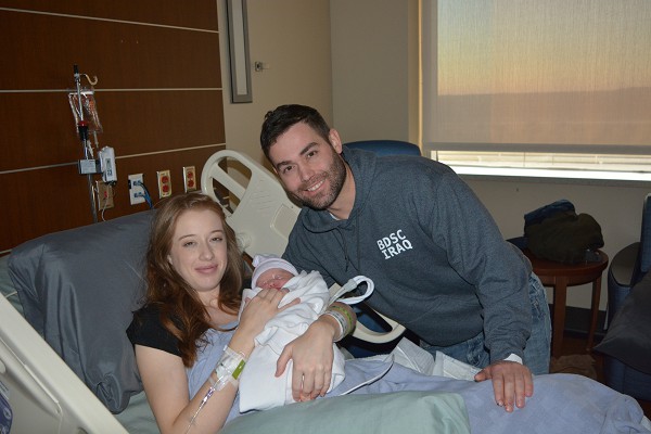 Fort Hood, Texas, January 1, 2023 -  Proud parents Cpt. Joshua, 1st CAV. Div., and Sabrina Austin pose with baby Millie Ellen after her delivery at the Carl R. Darnall Army Medical Center.