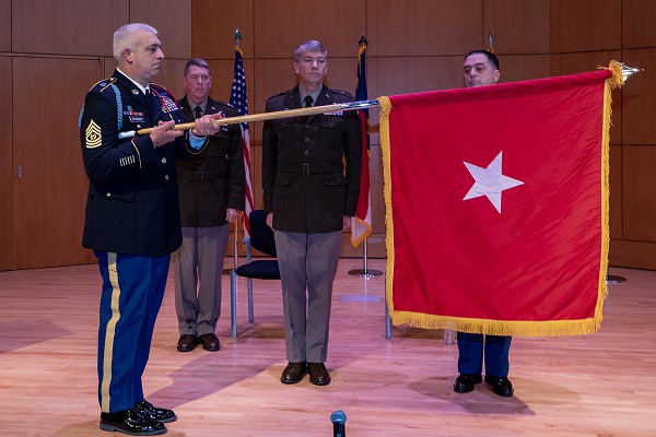 Raleigh, North Carolina, January 1, 203 - The North Carolina National Guard rings in the New Year by hosting a promotion ceremony for its newest brigadier general at a ceremony at NCNG Joint Force Headquarters in Raleigh, North Carolina, Jan. 1, 2023. Charles W. Morrison, center reviewing his new brigadier general’s flag, a 28-year NCNG veteran of two wartime deployments and numerous state active duty missions, will take those hard-earned skills and leadership lessons to the Pentagon as a Deputy Director with the Department of the Army.  Photo by Sgt. 1st Class Robert Jordan 