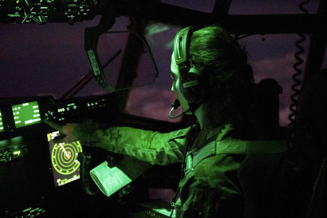 Air Force Capt. Madeleine Girardot flies a nighttime combat airlift mission from Camp Lemonnier, Djibouti, to a tactical forward operating base in East Africa, May 27, 2021.   Photo By Air Force Tech. Sgt. Daniel Asselta