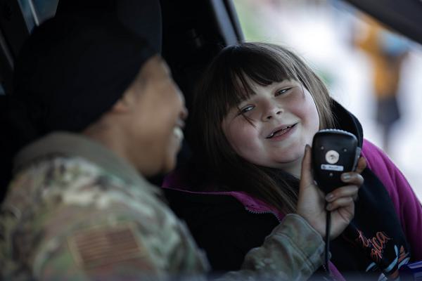 Alaska Air National Guard Staff Sgt. Latavia Despojo, left, a patrolman assigned to the 176th Security Forces Squadron, interacts with a Klatt Elementary School student during Red Ribbon Week in Anchorage, Alaska, Nov. 4, 2024. Red Ribbon Week is a nationwide campaign focused on promoting a healthy and drug-free lifestyle amongst the nation’s youth by delivering prevention information at school assemblies in collaboration with the Alaska National Guard Counterdrug Support Program, Drug Enforcement Agency, local law enforcement, and elected officials. The 2024 RRW events were held at six elementary schools across Anchorage and the Matanuska-Susitna Borough. (Alaska National Guard photo by Alejandro Peña)