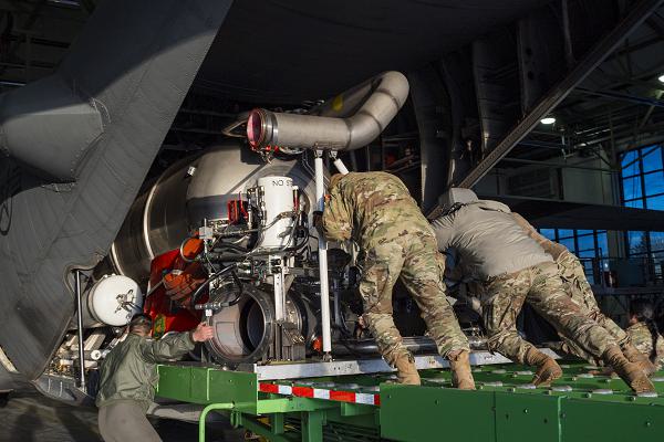 U.S. Air Force Airmen assigned to the 153rd Airlift Wing load and install the Modular Airborne Fire Fighting Systems, or MAFFS, on to a C-130H Hercules aircraft in Cheyenne, Wyoming, Jan. 10, 2025, in preparation to support firefighting efforts in the Los Angeles area. U.S. Northern Command activated three Wyoming Air National Guard C-130s equipped with MAFFS and associated personnel to assist firefighting efforts in California. MAFFS, developed by the U.S. Forest Service, are portable fire-retardant delivery systems that convert C-130s into airtankers, capable of releasing up to 3,000 gallons of retardant in under five seconds. (U.S. Air Force National Guard photo by Staff Sgt. Zachary Herold)