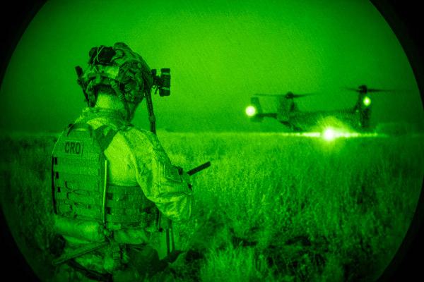 A U.S. Air Force pararescueman assigned to the 82nd Expeditionary Rescue Squadron secures the landing zone after being dropped off by an MV-22B Osprey during a personnel recovery training exercise at an undisclosed location near Camp Lemonnier, Djibouti, December 15, 2024. The exercise challenged Airmen from the 82nd ERQS, the 10 Expeditionary Aeromedical Evacuation Flight, and Marines from the Marine Medium Tiltrotor Squadron 266 to deliver critical care in low-light and high-pressure environments. (U.S. Air Force photo by Staff Sgt. Jana Somero)