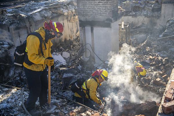 March Field Fire Emergency Services from March Air Reserve Base stationed in Moreno Valley, Calif., assisted in fire suppression efforts against the Eaton Fire in the Altadena Neighborhood of Los Angeles, Calif., on Jan. 13, 2025. Firefighters Ruben Anaya, Dakota Christensen, Brandon Dubouis, Michael Goodman, and Jack Cools were assigned to Strike Team 6050A, Division N, performing overhaul duties to locate and extinguish residual fires and hot spots, preventing potential reignition.