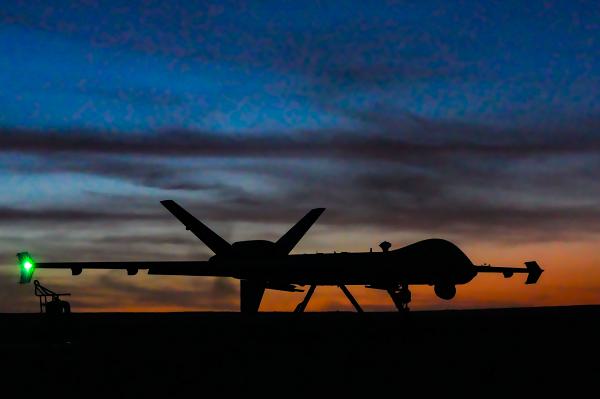 An MQ-9 Reaper assigned to the 1st Special Operations Wing rests on a dirt strip at sunset following a successful landing during exercise Reaper Castillo at Melrose Air Force Range, N.M., Dec. 16, 2024. The exercise validated the MQ-9’s ability to conduct key operations in austere environments, including dirt-strip landings, refueling, re-arming and rapid relaunch. (U.S. Air Force photo by Airman 1st Class Gracelyn Hess) 