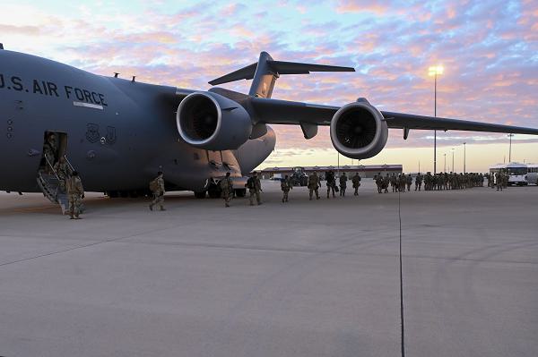 One-hundred and ten U.S. Soldiers assigned to the 66th Military Police Company exit an 62nd Airlift WingC-17 Globemaster III at Fort Bliss, Texas, Jan. 25, 2025. U.S. Northern Command is working together with the Department of Homeland Security to augment U.S. Customs and Border Protection along the southern border with additional military forces. This initial deployment of 1,500 active-duty personnel brings the total military Title 10 forces along the border to nearly 4,000 personnel. (Department of Defense photo by Senior Airman Elizabeth Schoubroek)