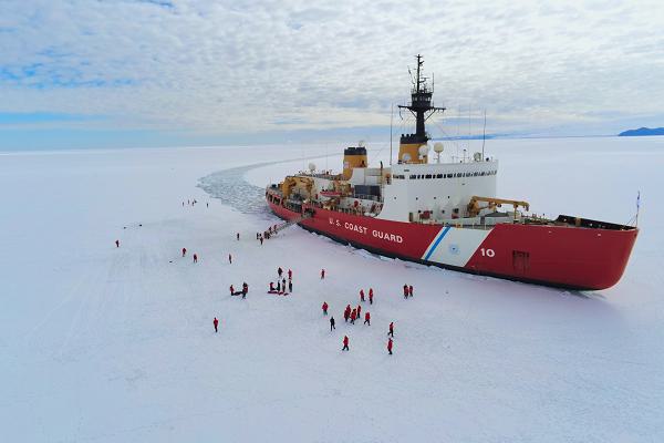 The crew of U.S. Coast Guard Cutter Polar Star (WAGB 10) enjoys ice liberty while the cutter sits hove-to in McMurdo Sound during Operation Deep Freeze, Jan. 7, 2025. Polar Star is conducting ice-breaking operations in Antarctica in support of Operation Deep Freeze, a joint service, inter-agency support operation for the National Science Foundation, which manages the United States Antarctic Program.  (U.S. Coast Guard photo by Petty Officer 2nd Class Jeremy Burgess)