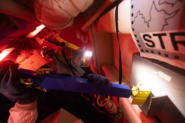 Retail Services Specialist 2nd Class James Rivera, from San Bernardino, California, applies metal shoring to a box patch during a structural damage and flooding drill aboard the Arleigh Burke-class guided-missile destroyer USS Preble (DDG 88) in the Philippine Sea, Jan. 24. Preble is forward-deployed and assigned to Destroyer Squadron (DESRON) 15, the Navy's largest DESRON and the U.S. 7th Fleet's principal surface force. (U.S. Navy photo by Mass Communication Specialist 1st Class Ryre Arciaga)                                                    