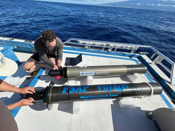 Researchers prepare the Persistent Smart Acoustic Profiler (PSAP) Voyager for initial testing in Monterey Bay. Through PSAP’s ongoing operational test off the coast of Hawaii, the team has received troves of oceanographic and passive acoustic data to be used for upcoming NPS student research. (Photo courtesy Seatrec)