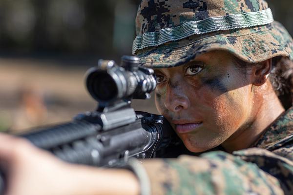 U.S. Marine Corps Cpl. Ava Alegria, a combat photographer with Headquarters and Service Battalion, aims her rifle during a Corporals Course culminating event at Marine Corps Recruit Depot Parris Island, S.C., Feb 4, 2025. Corporals Course is a specialized training program designed to develop leadership skills and tactical proficiency among non-commissioned officers. (U.S. Marine Corps photo by Lance Cpl. Ayden Cassano)
