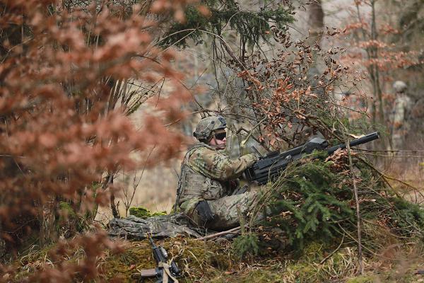 U.S. Army Spc. Zachery Curtiss, a fire control specialist with 5-25 Charlie Battery, 3rd Brigade, 10th Mountain Division, pulls security with a M-19 automatic grenade launcher at the Joint Multinational Readiness Center in Hohenfels, Germany, Jan. 31, 2025. Curtis is in a field artillery unit participating in exercise Combined Resolve 25-1, a multi-domain exercise in Europe. (U.S. Army Reserve photo by Staff Sgt. Tristan Peete.)