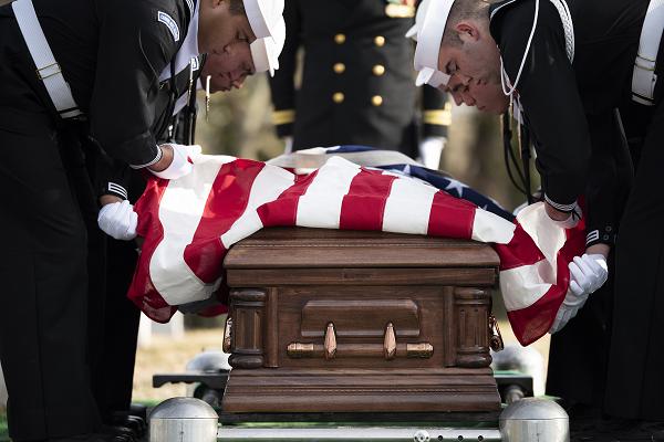 Sailors from the U.S. Navy Ceremonial Guard and the U.S. Navy Ceremonial Band conduct military funeral honors with funeral escort for U.S. Navy Seaman 1st Class Aaron L. McMurtrey in Section 69 of Arlington National Cemetery, Arlington, Virginia, Thursday, Feb. 13, 2025. McMurtrey was killed during WWII at age 27.From a Defense POW/MIA Accounting Agency (DPAA) press release:On Dec. 7, 1941, McMurtrey was assigned to the battleship USS California, which was moored at Ford Island, Pearl Harbor, when the ship was attacked by Japanese aircraft. The USS California sustained multiple torpedo and bomb hits which caused it to catch fire and slowly flood. The attack on the ship resulted in the deaths of 103 crewman, including McMurtrey.From December 1941 to April 1942, Navy personnel recovered the remains of the deceased crew and subsequentially interred them in the Halawa and Nu’uanu Cemeteries in Hawaii.In September 1947, members of the American Graves Registration Service (AGRS) disinterred the remains of U.S. causalities from these cemeteries and transferred them to the Central Identification Laboratory at Schofield Barracks as part of their task to recover and identify fallen U.S. personnel from the Pacific Theater. In addition to the 42 causalities initially identified from the USS California after the attack, the laboratory staff was only able to confirm the identifications of 39 men from the ship, none of which were McMurtrey. The AGRS subsequently buried the outstanding unidentified remains in the National Memorial Cemetery of the Pacific (NMCP) (also known as the Punchbowl) in Honolulu. In October 1949, a military board classified the remains of the unidentified USS California crew members, including McMurtrey, as non-recoverable.In 2018, DPAA personnel exhumed the 25 USS California Unknowns from the Punchbowl for analysis. Anthropological analysis by scientists at DPAA and mitochondrial DNA (mtDNA) and Y chromosome DNA (Y-STR) analysis by scientists at the Armed Forces Medical Examiners System were used to finally identify McMurtery’s remains.McMurtrey was officially accounted for on July 31, 2024, over 80 years since his death. McMurtery’s niece, Sharon Gunselman, received the U.S. flag from his funeral service.(U.S. Army photo by Elizabeth Fraser / Arlington National Cemetery / released)