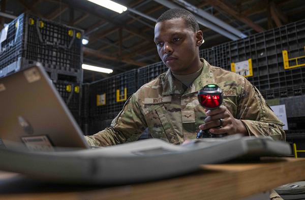 U.S. Air Force Airman 1st Class Deshawn White, 52nd Logistics Readiness Squadron material management, scans individual plates into a Radio Frequency Identification (RFID) system at Spangdahlem Air Base, Germany, Feb. 7, 2025. By installing RFID technology, LRS will eliminate 7,000 man-hours annually in inventory procedures, expedite mass distribution in the event of a chemical attack and increase deployment processing capability. (U.S. Air Force Senior Airman Jessica Sanchez-Chen)