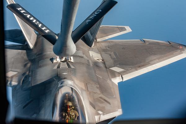 A U.S. Air Force KC-135 Startotanker assigned to the 203rd Air Refueling Squadron refuels an F-22A Raptor operated by members of the 199th and 19th Fighter Squadrons, assigned to the 199th Fighter Squadron near the Hawaiian Islands, Feb 5, 2025 for Sentry Aloha 25-1. Fighter jets, tankers, and support units participated in simulated combat scenarios, enhancing interoperability and readiness among U.S. military forces. (U.S. Air National Guard photo by Senior Airman Roann Gatdula)