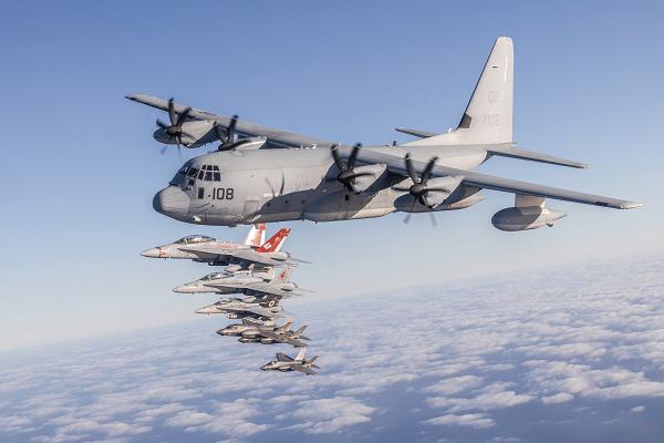 U.S. Marines and aircraft with Marine Aircraft Group 11, 3rd Marine Aircraft Wing, conduct a formation flight as part of Project Legacy off the coast of San Diego, March 4, 2025. The Project Legacy flight was a unique opportunity for all aircraft platforms across MAG-11 to fly as one team, practice tight formations, and take part in the documentation of a historical flight. (U.S. Marine Corps photo by Lance Cpl. Jennifer Sanchez)